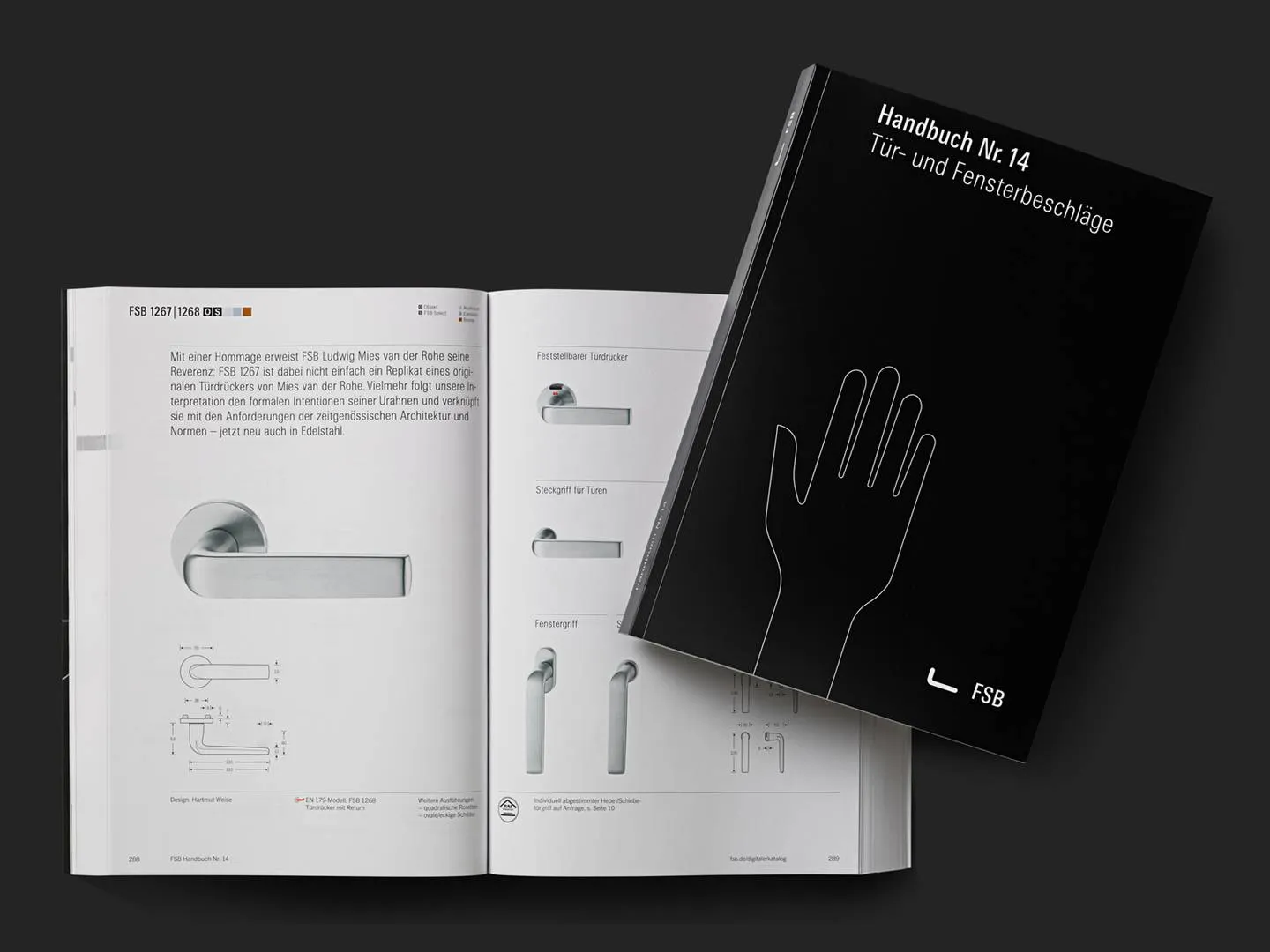 Aufgeschlagener FSB Produktkatalog mit Edelstahlgriffen und technischem Layout. Hochwertiges Designmotiv für Architektur-,und Markenkommunikation.